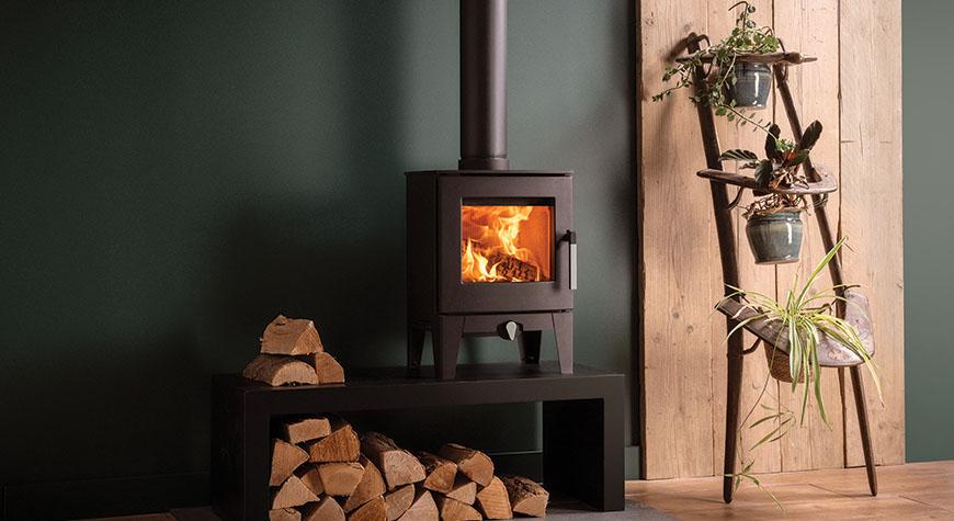 Stovax Futura 4 Wood Burning stove. Shown installed on a Stovax 120 High Bench.