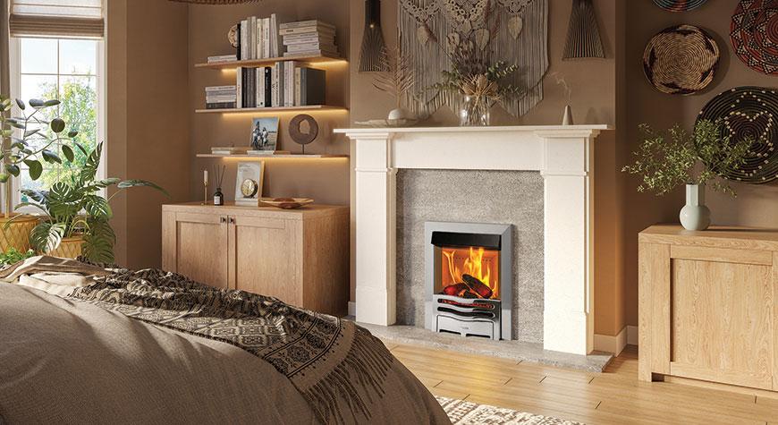 Cosy bedroom featuring the Onyx Mirage 40i electric fire, shown with Highlight Polished Wave Front. Shown with Claremont Limestone mantel.