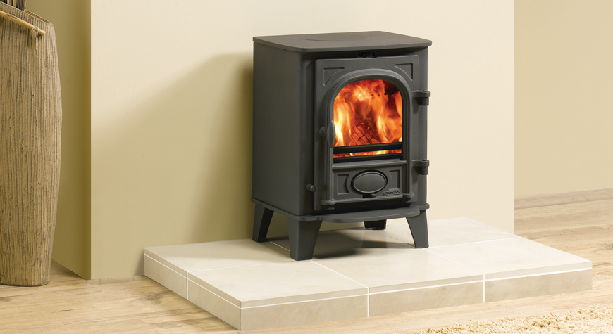 Stovax Stockton 3 stove in Matt Black, burning logs.